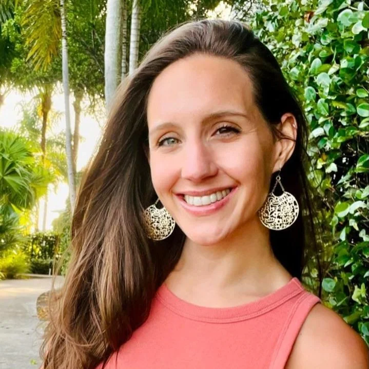 Smiling woman outdoors in warm light, symbolizing compassion, healing, and connection through trauma therapy and eating disorder recovery. Orlando, FL