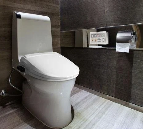 BioBidet BB-1000 installed on toilet at home bathroom with remote control installed on the wall