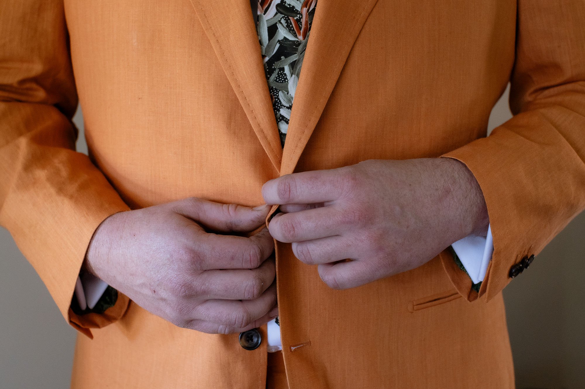Groom Buttoning up Jacket