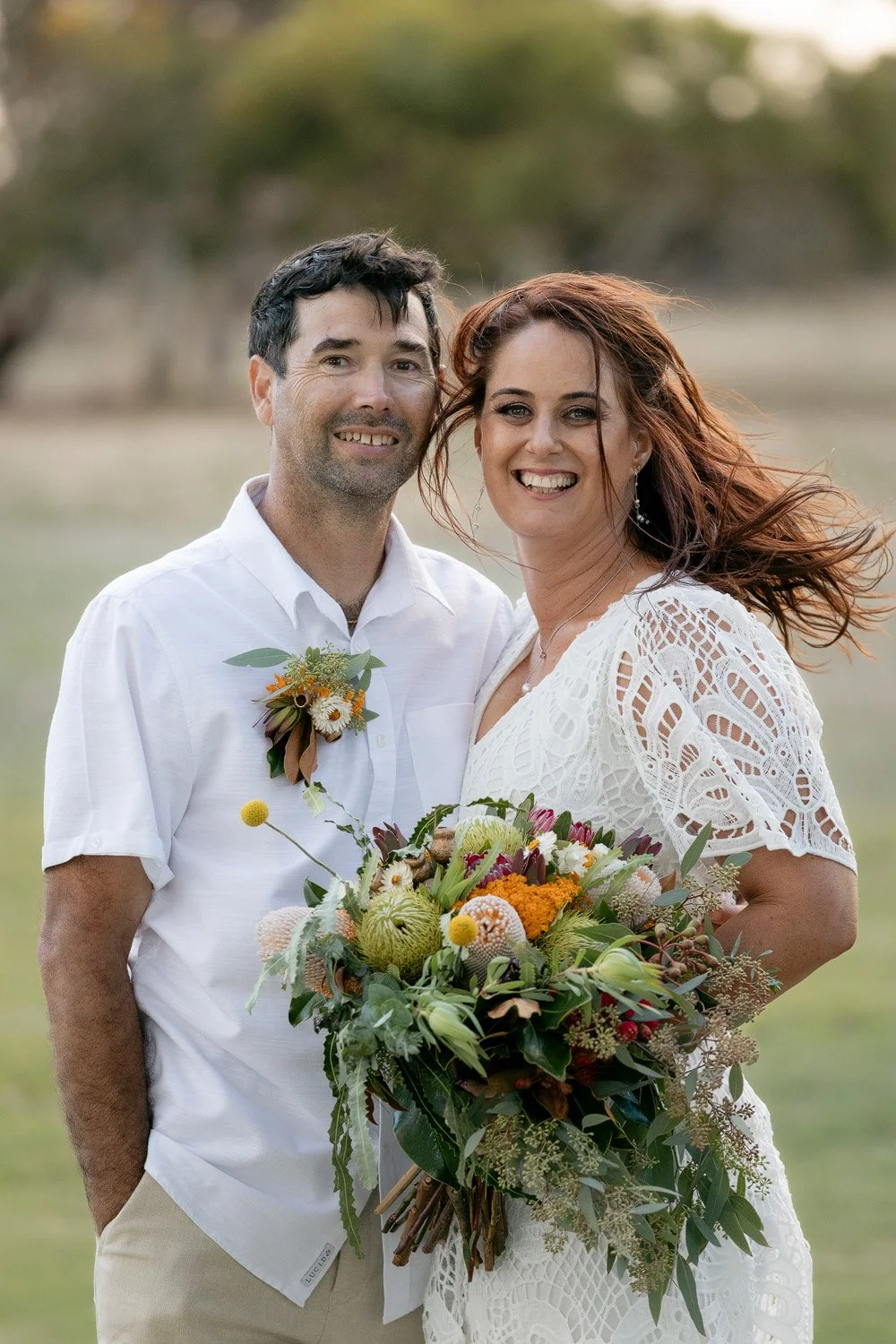 Bride and Groom looking at camera