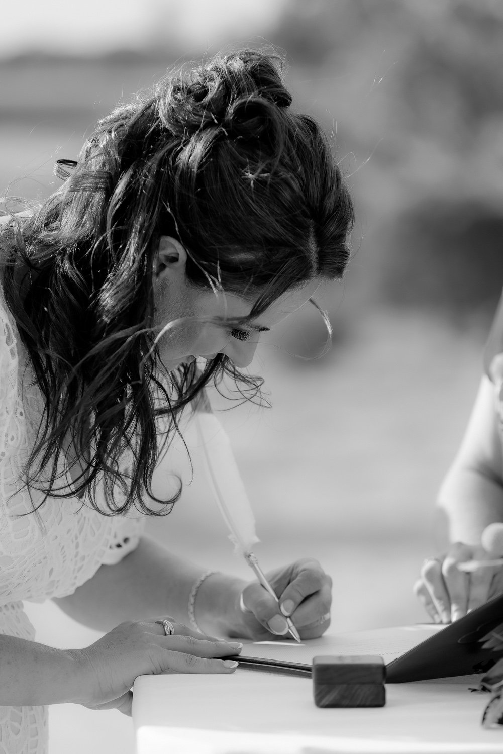 Bride signing Marriage Certificate