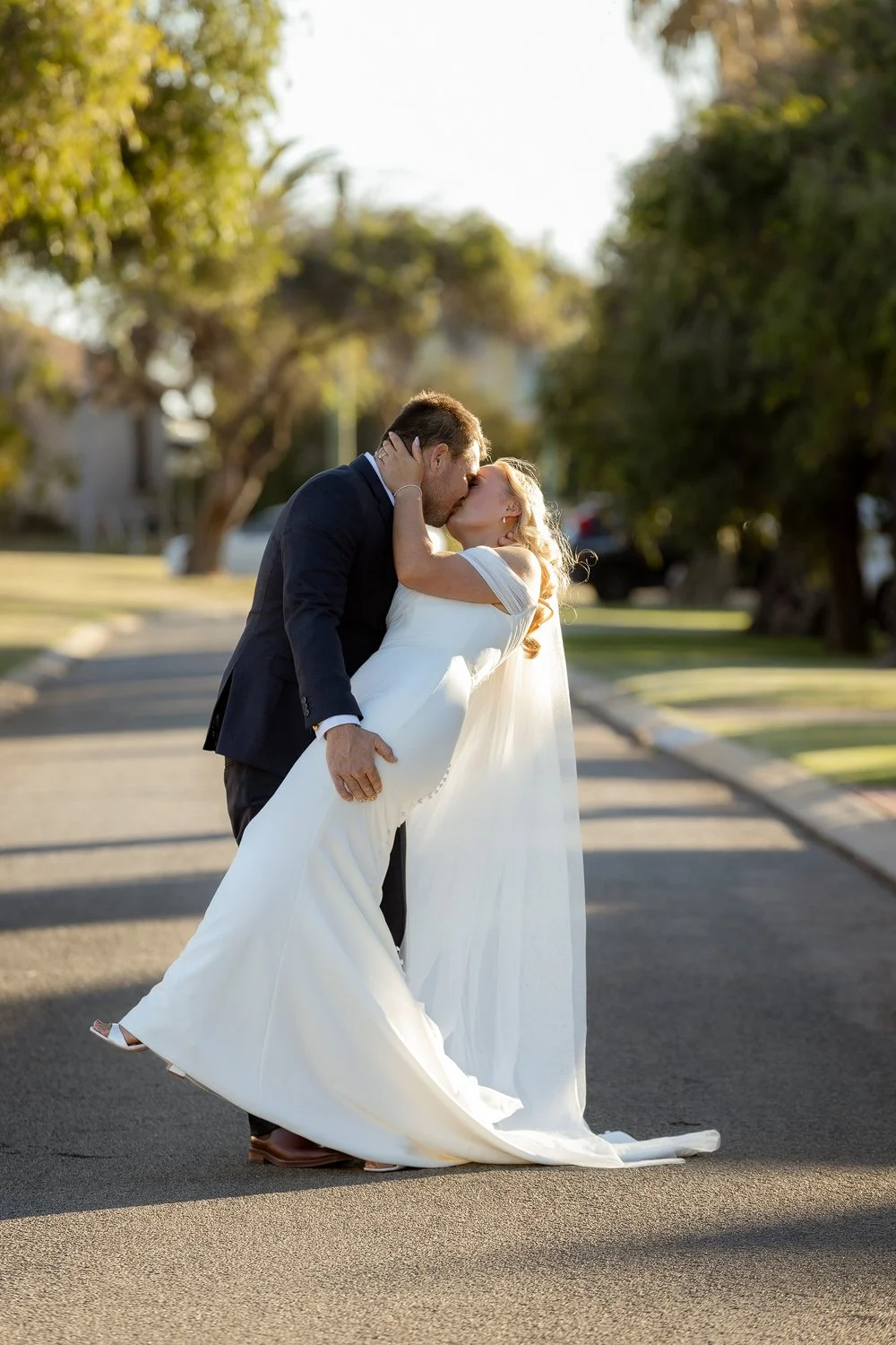 Bride and Groom kiss and dip