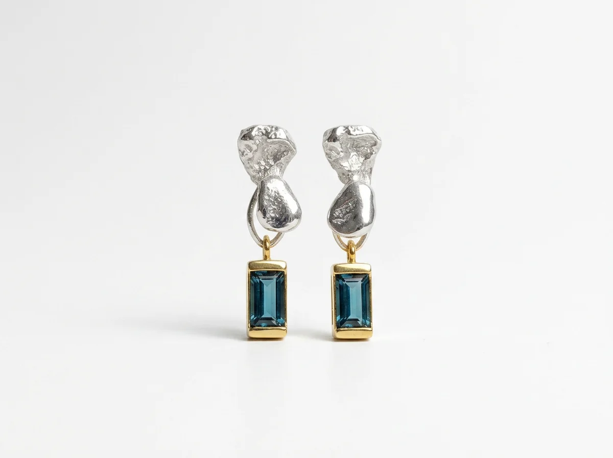mixed gold and silver drop earrings with London blue topaz