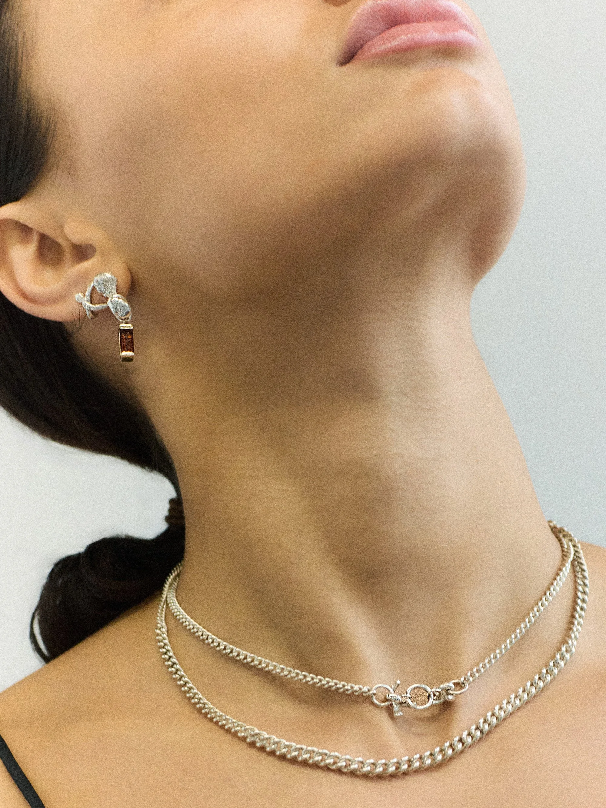 Two silver necklaces and drop stud earrings
