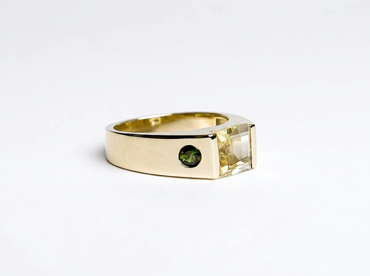 Side view of citrine and green tourmaline ring