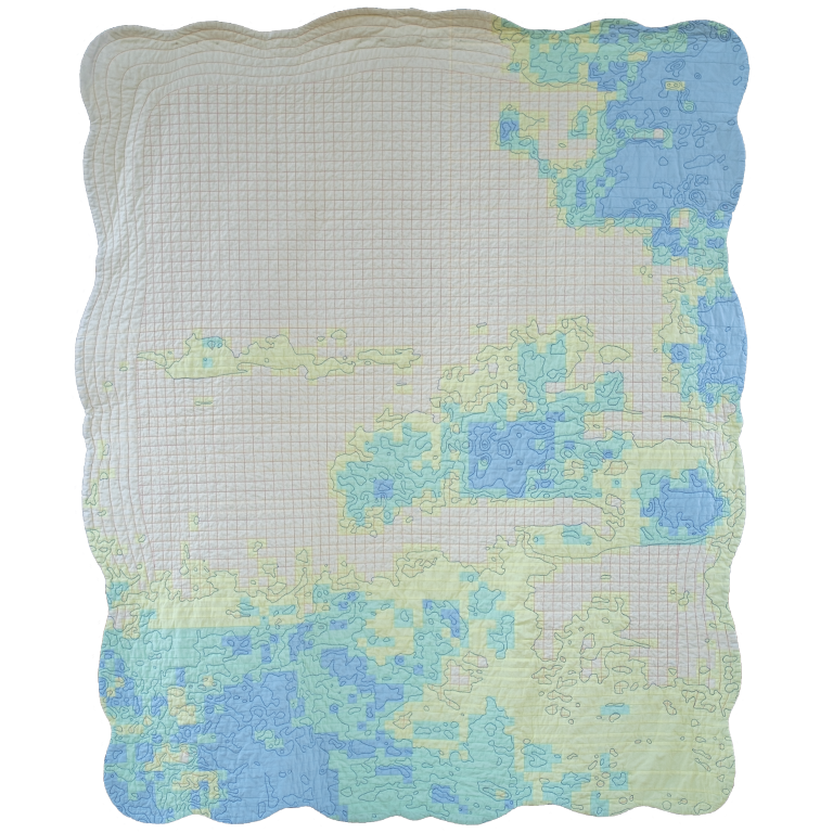 Cream quilt with curved frame border and pale blue and green pieced forms