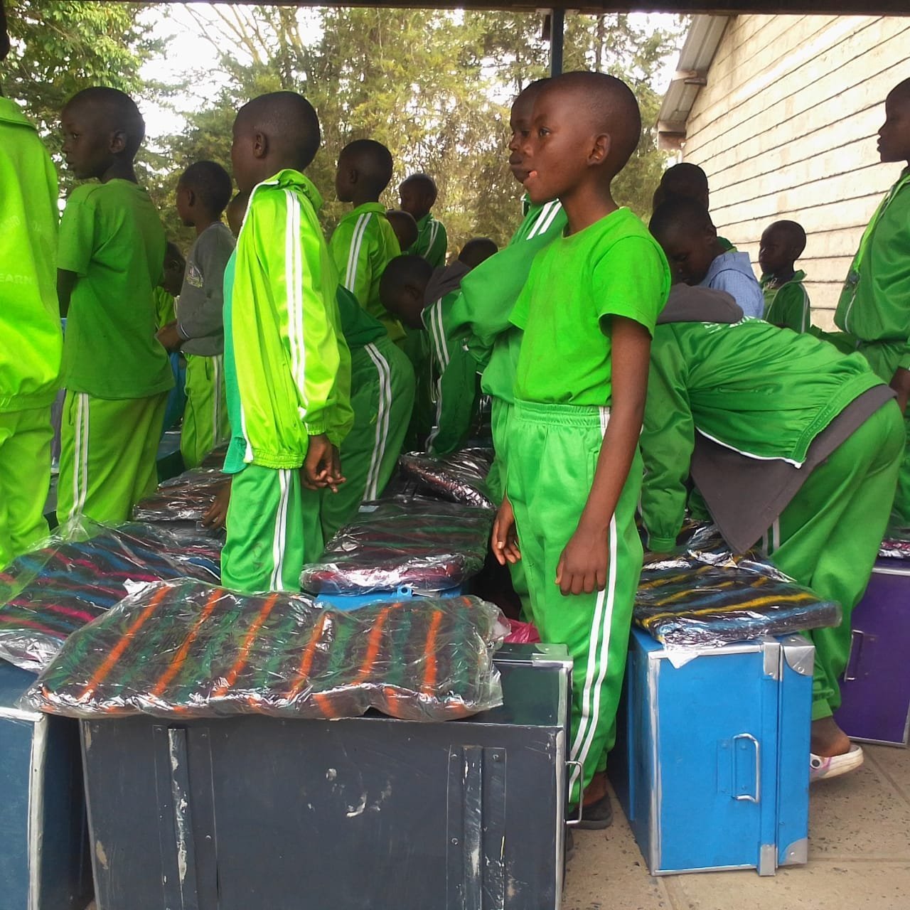 Students assembled with new trunks and blankets