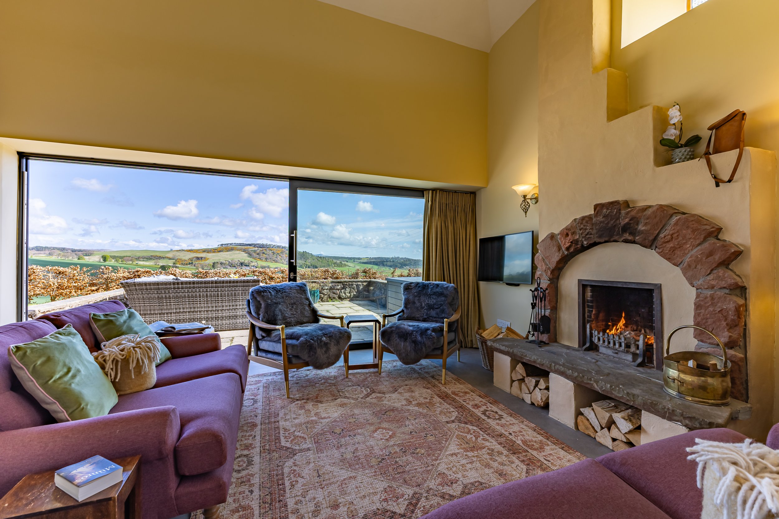 New Outfield internal fire on sofas and 2 chairs and view.jpg