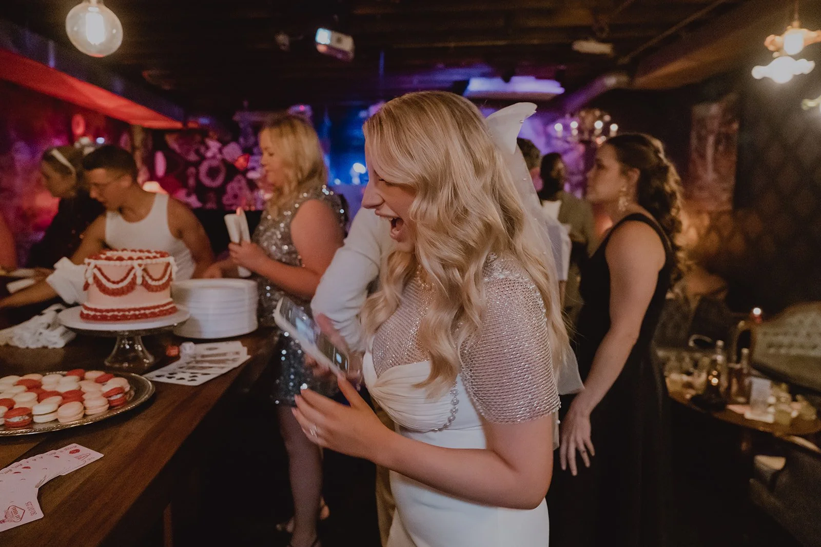 Bride reacting with excitement at her reception details during a Velveteen Rabbit Las Vegas micro wedding reception.