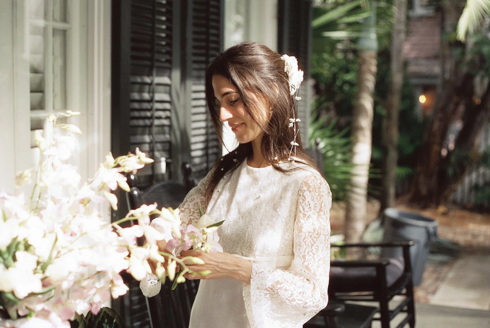 Bride admiring her florals.