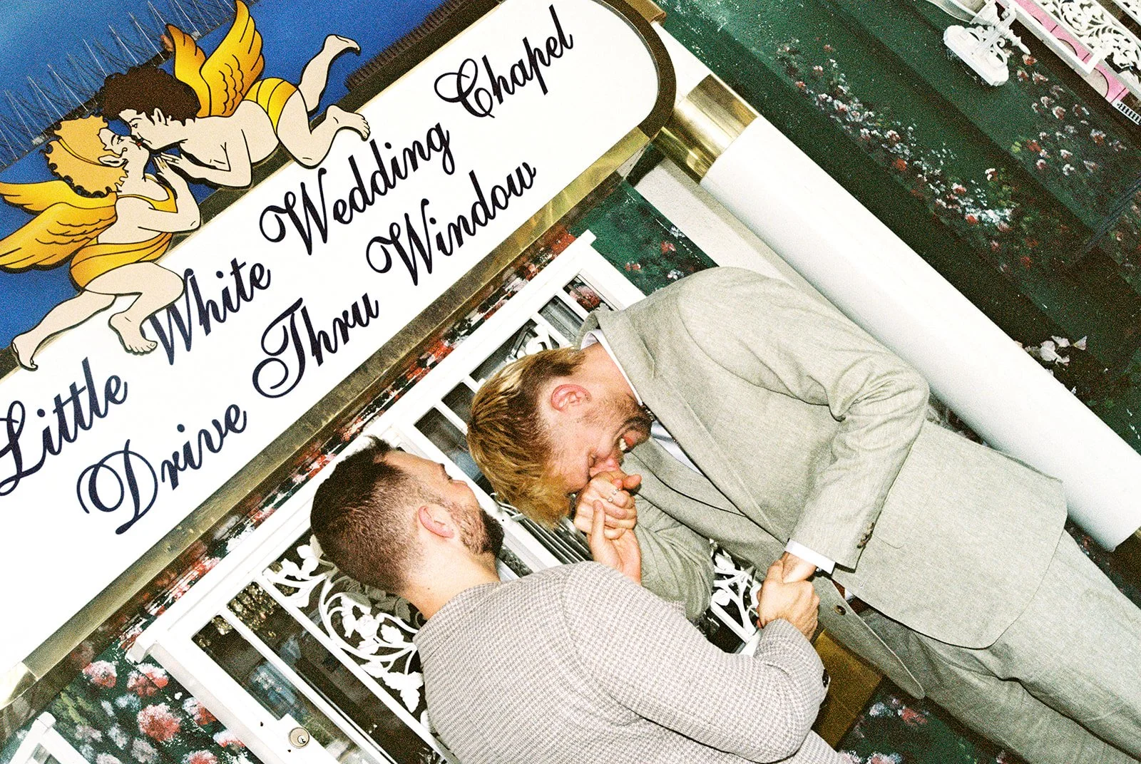 Couple getting emotional during their 35mm film Little White Chapel elopement ceremony in Las Vegas.