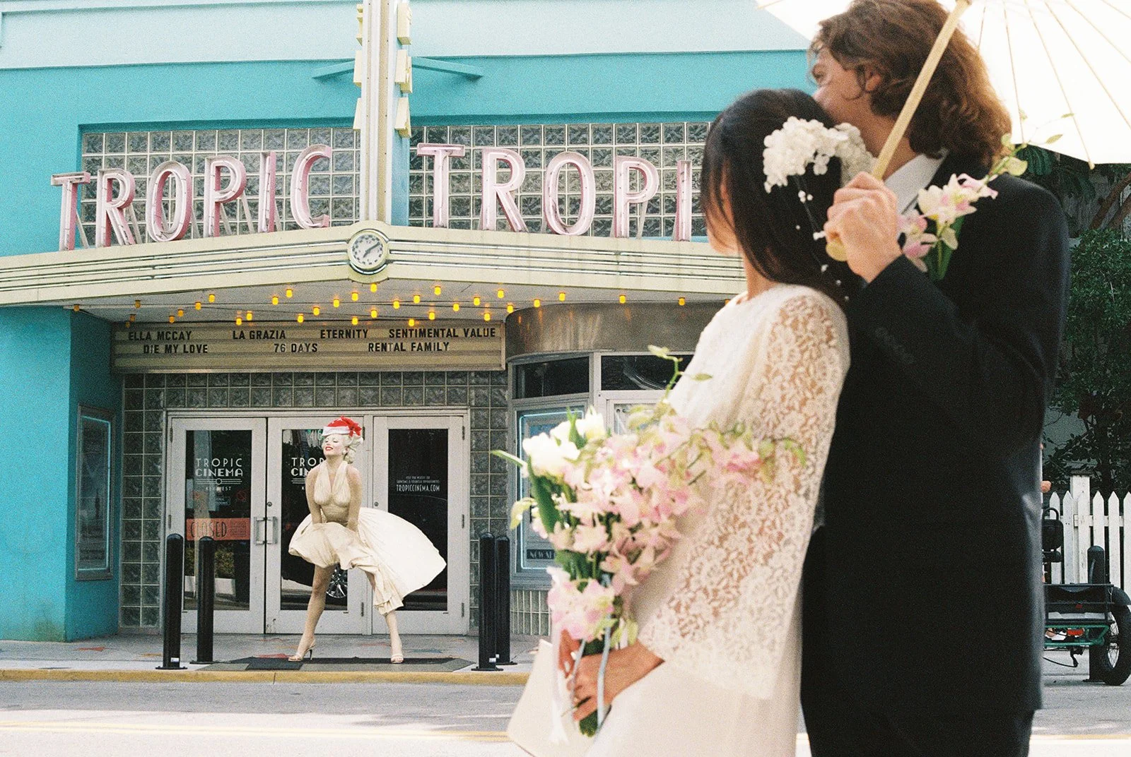 35mm film photo of a couple posing in front of Tropic Cinema in Key West Florida.