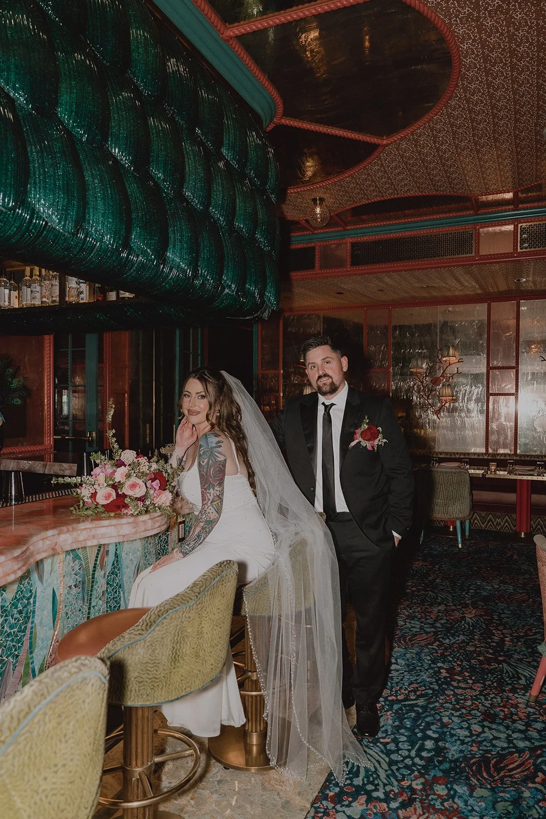 Bride and groom posing at the bar inside The Matfair Supper Club in Las Vegas.