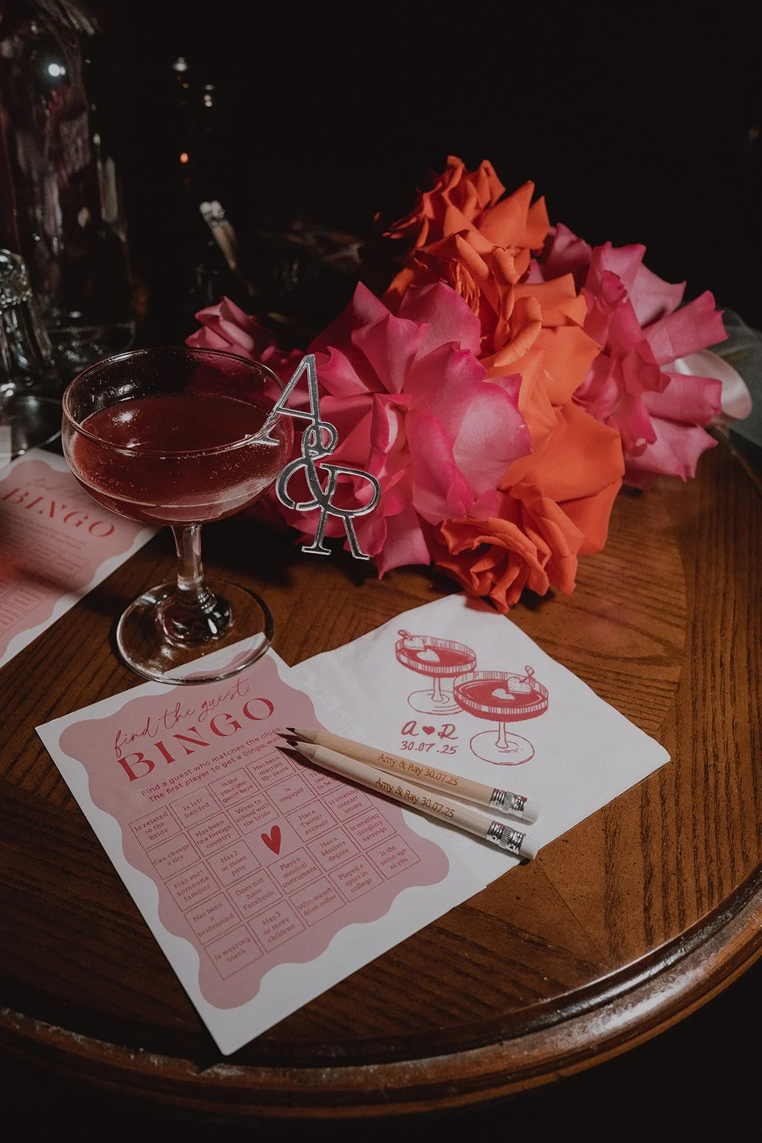 Wedding reception details at Velveteen Rabbit including vintage custom games, florals, and cocktails.