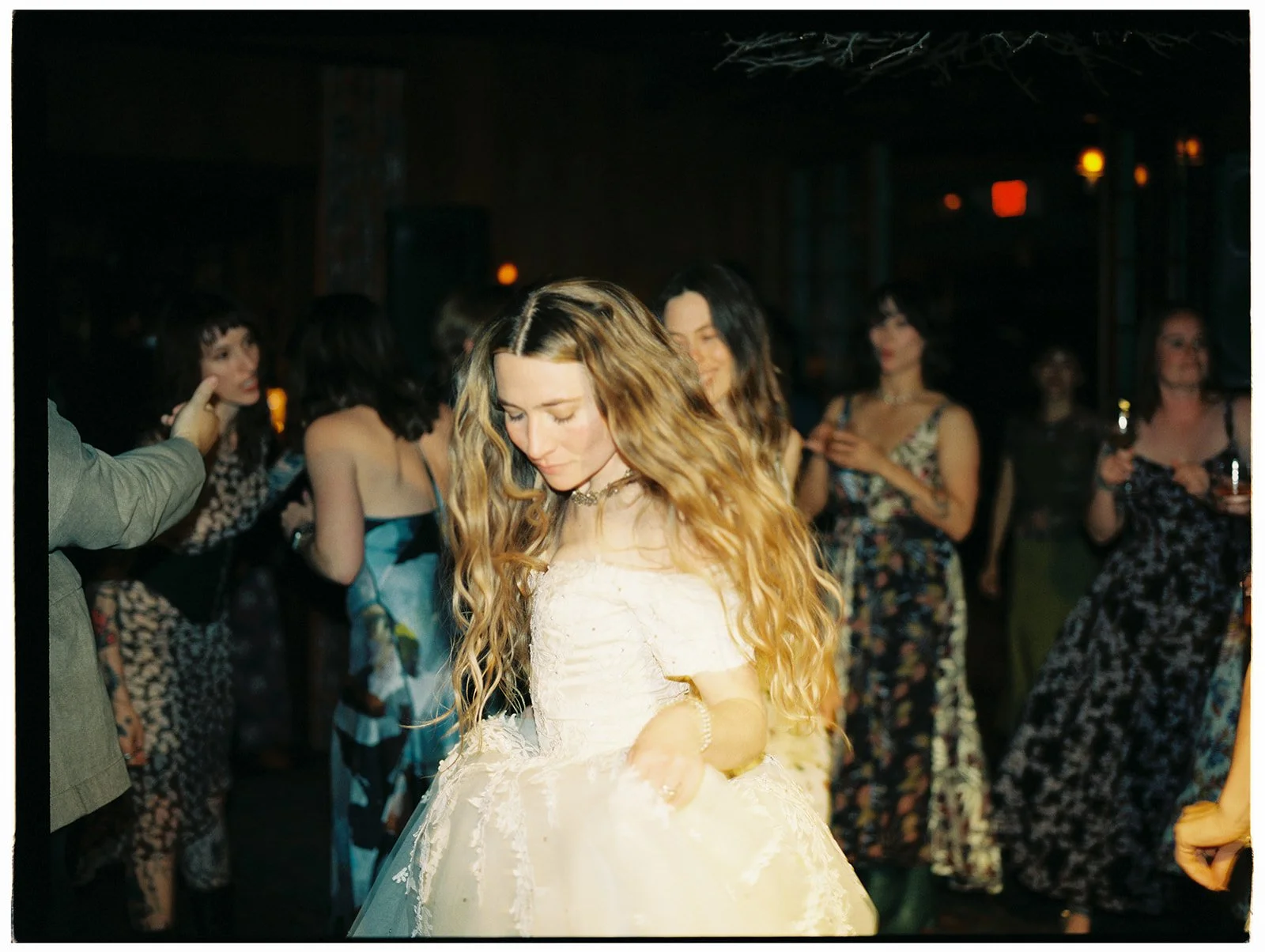 Film photo of the bride dancing with guests during the reception at Deer Mountain Inn.