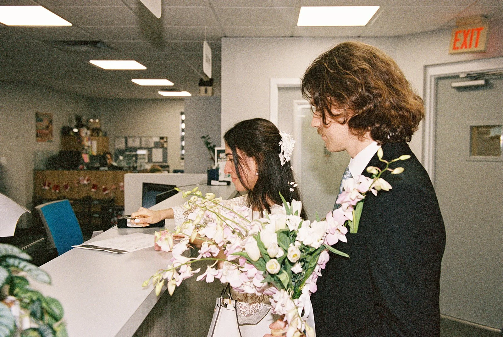 Couple checking in for their ceremony at Monroe County Courthouse in Key West, FL