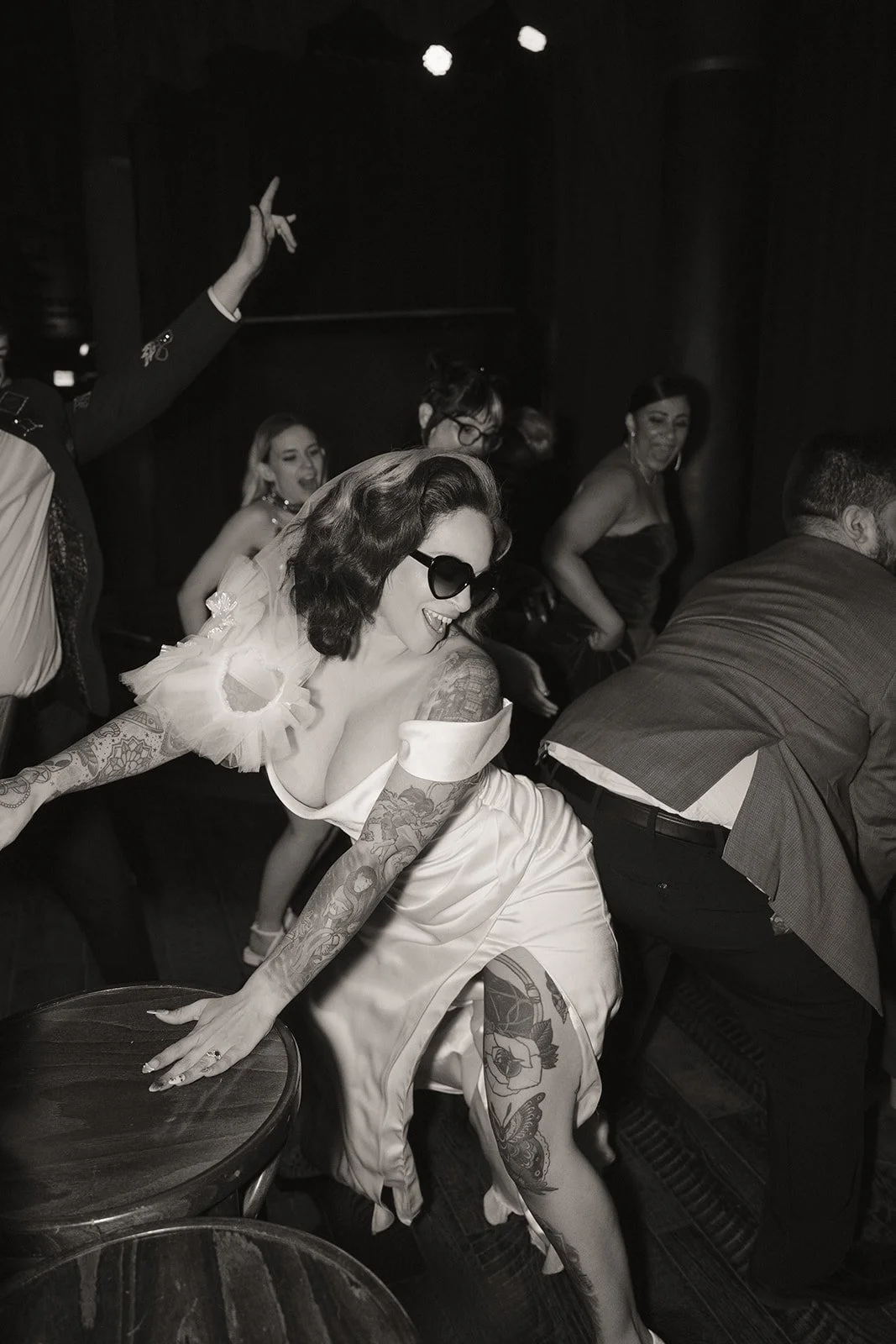 Bride dancing with guests on the dance floor during Cheapshot Las Vegas wedding reception.
