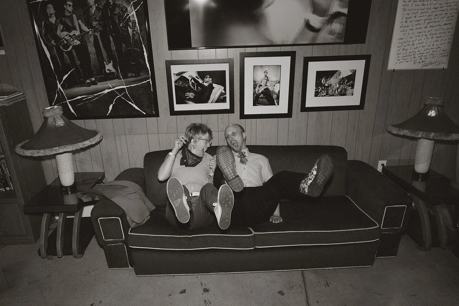 Couple sitting on a couch together at The Punk Rock Museum in Las Vegas.