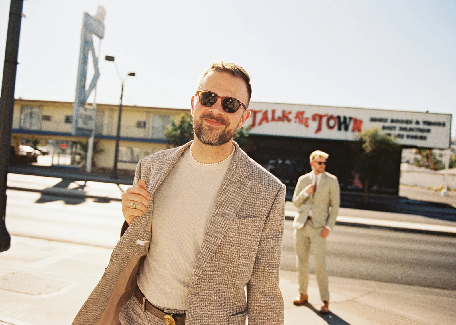 Man strutting in front of the camera during his 35mm film Las Vegas elopement photos.