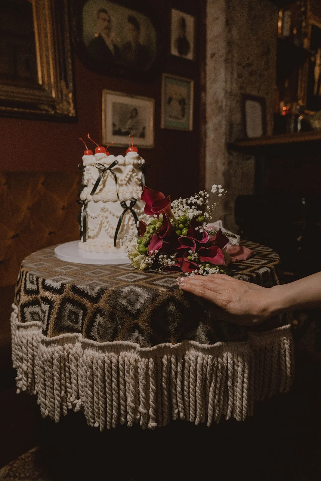 Las Vegas elopement detail shot with a cake and flowers styled on a table inside of The Laundry Room.