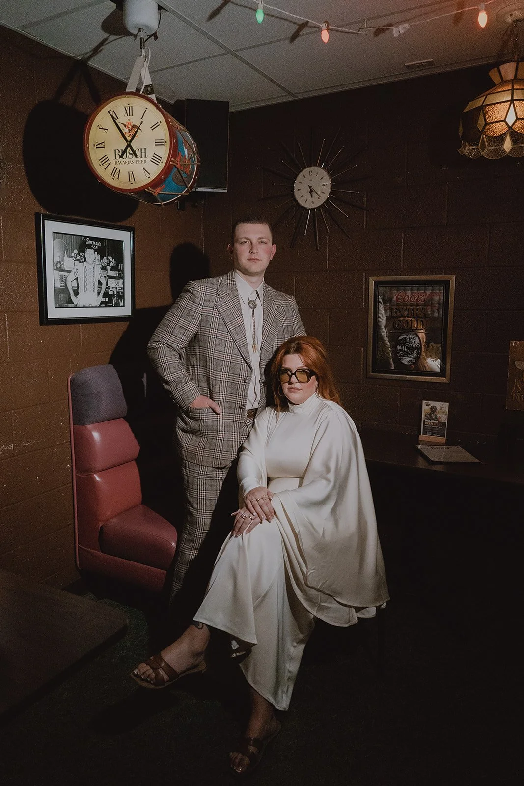 Couple sitting inside The Silver Stamp for their Las Vegas photos.