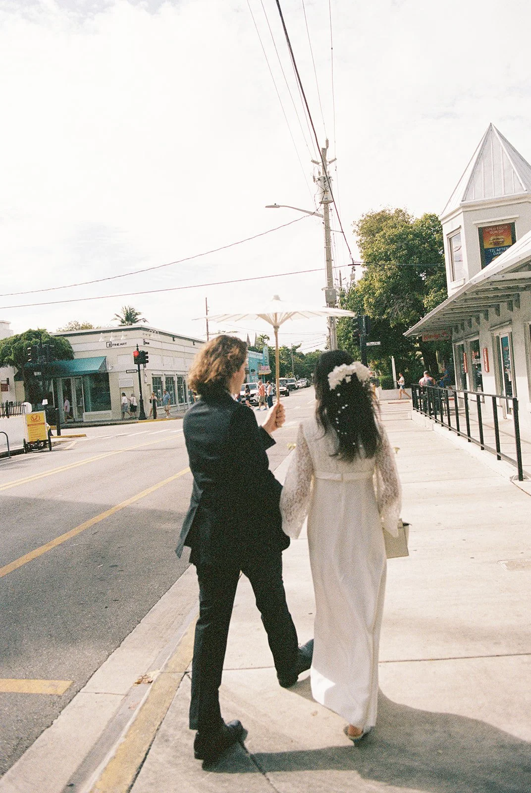 35mm film photo of a couple walking downtown together in Key West Florida.