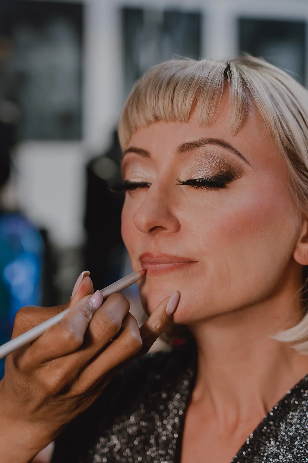Behind-the-scenes makeup application on Zoey Goto during the Showgirl Bootcamp Experience, photographed on digital and film.
