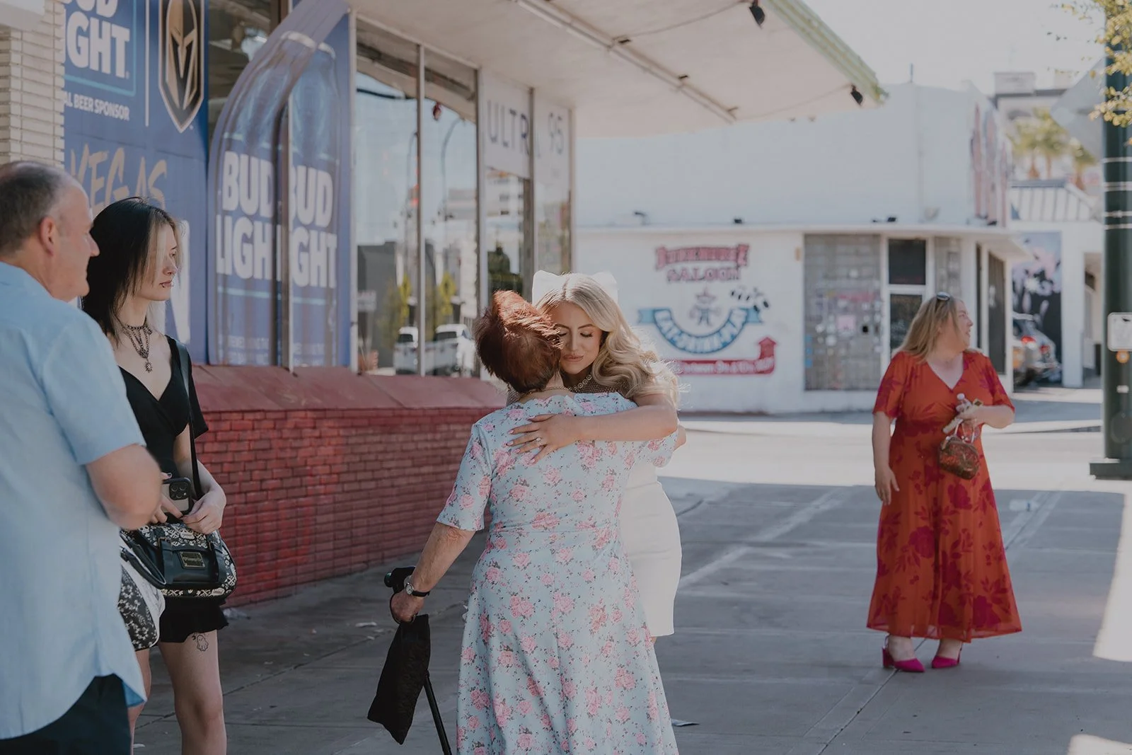 Bride hugging family and friends outside of Sure Thing Chapel in Las Vegas.