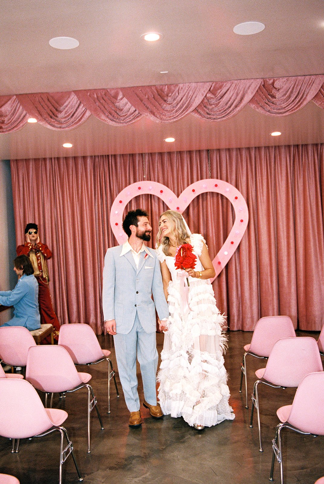 Couple walking back down the aisle as husband and wife after their Sure Thing Chapel elopement in Las Vegas.