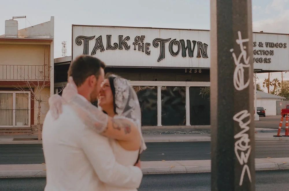Bride and Groom celebrating on the streets of Las Vegas near the Little White Wedding Chapel