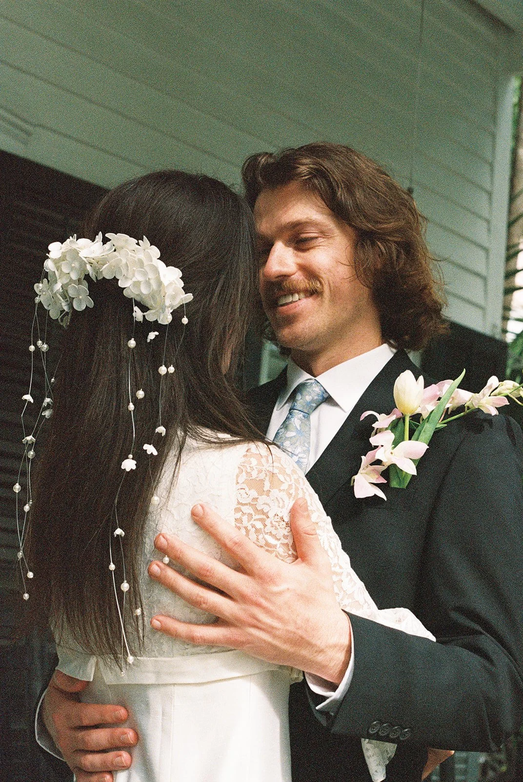 Bride and groom hugging each other at Old Town Manor in Key West, Florida.