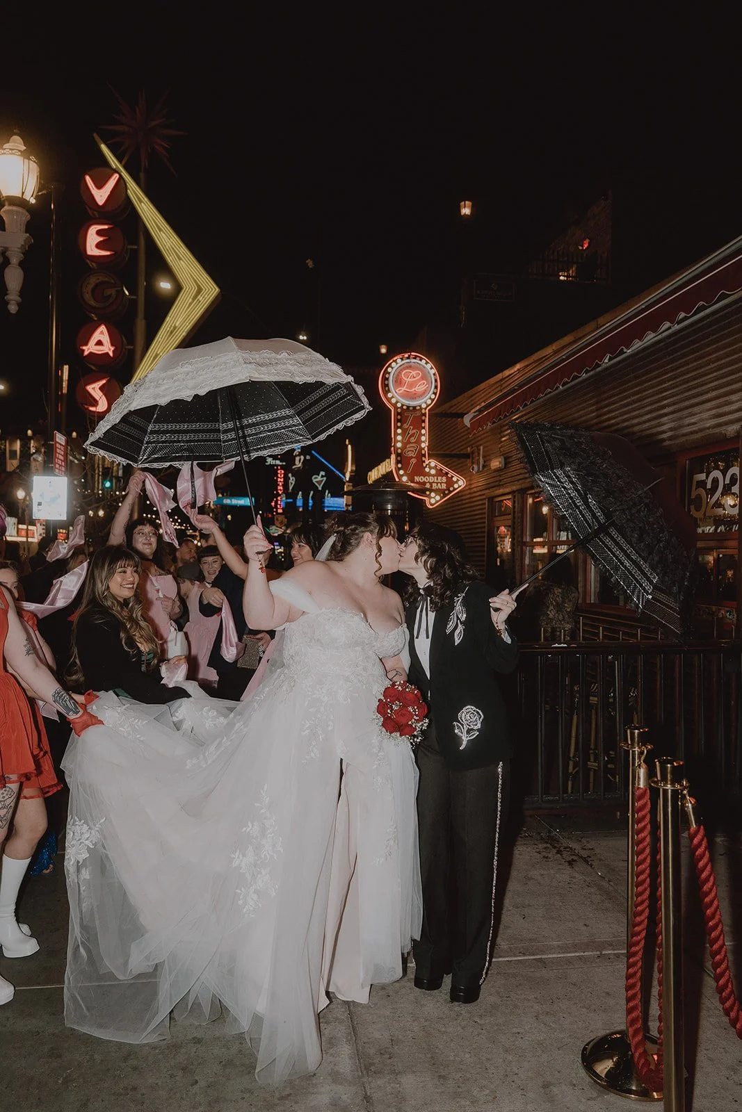 Couple kissing on Fremont Street wedding parade in Las Vegas.