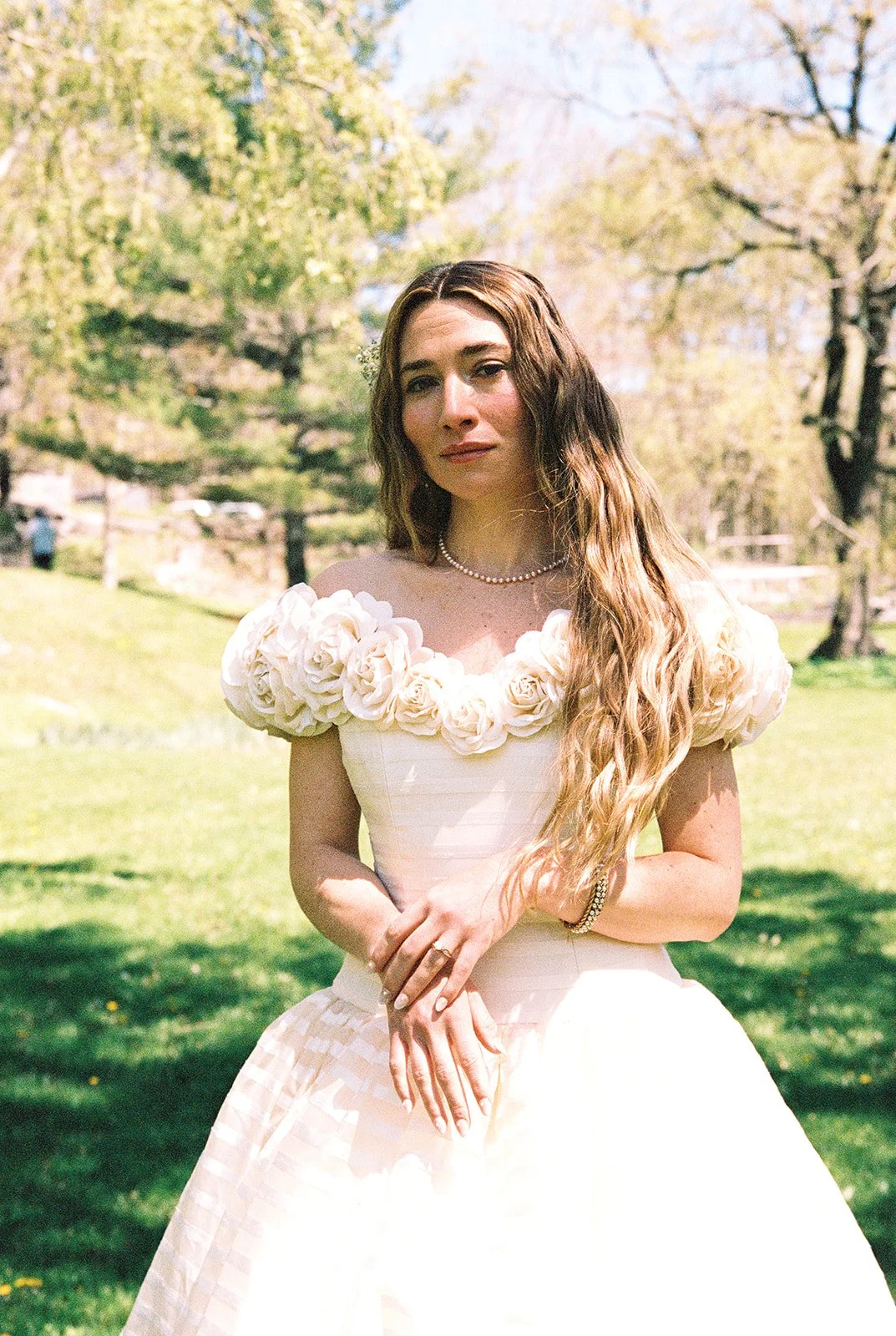 Bride posing outdoors before her first look.