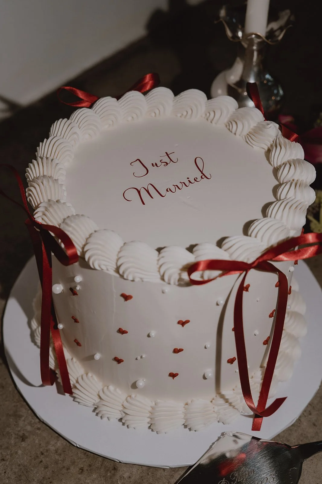 A small micro wedding cake that says Just Married.