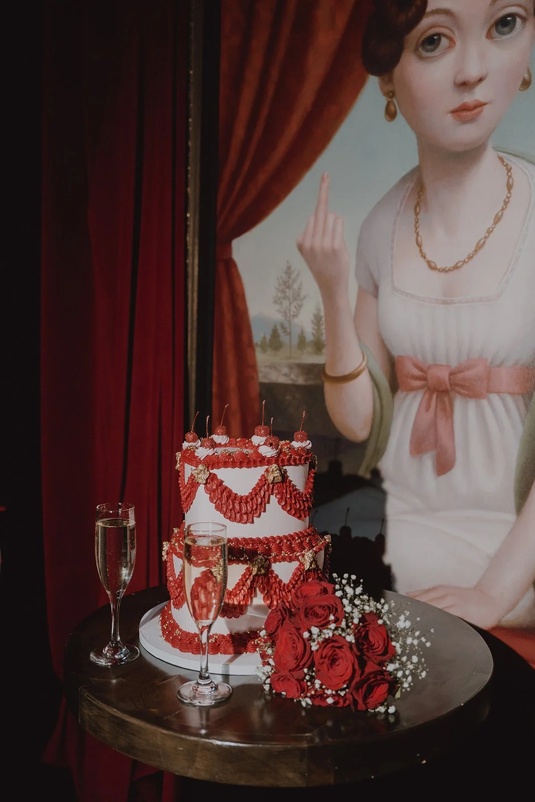 Red and white wedding cake by Winston Marie Cakes at Cheapshot in Las Vegas.
