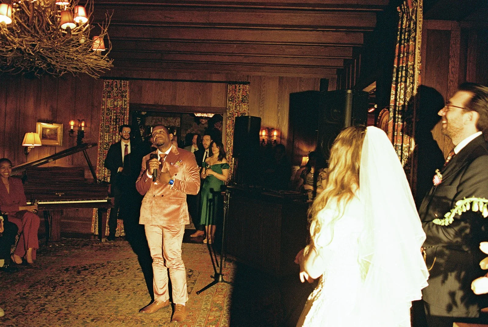Guest giving a speech during a Deer Mountain Inn wedding reception.