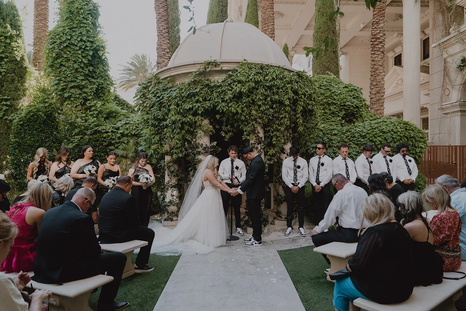 Wide shot of an outdoor Caesars Palace Venus Garden wedding ceremony