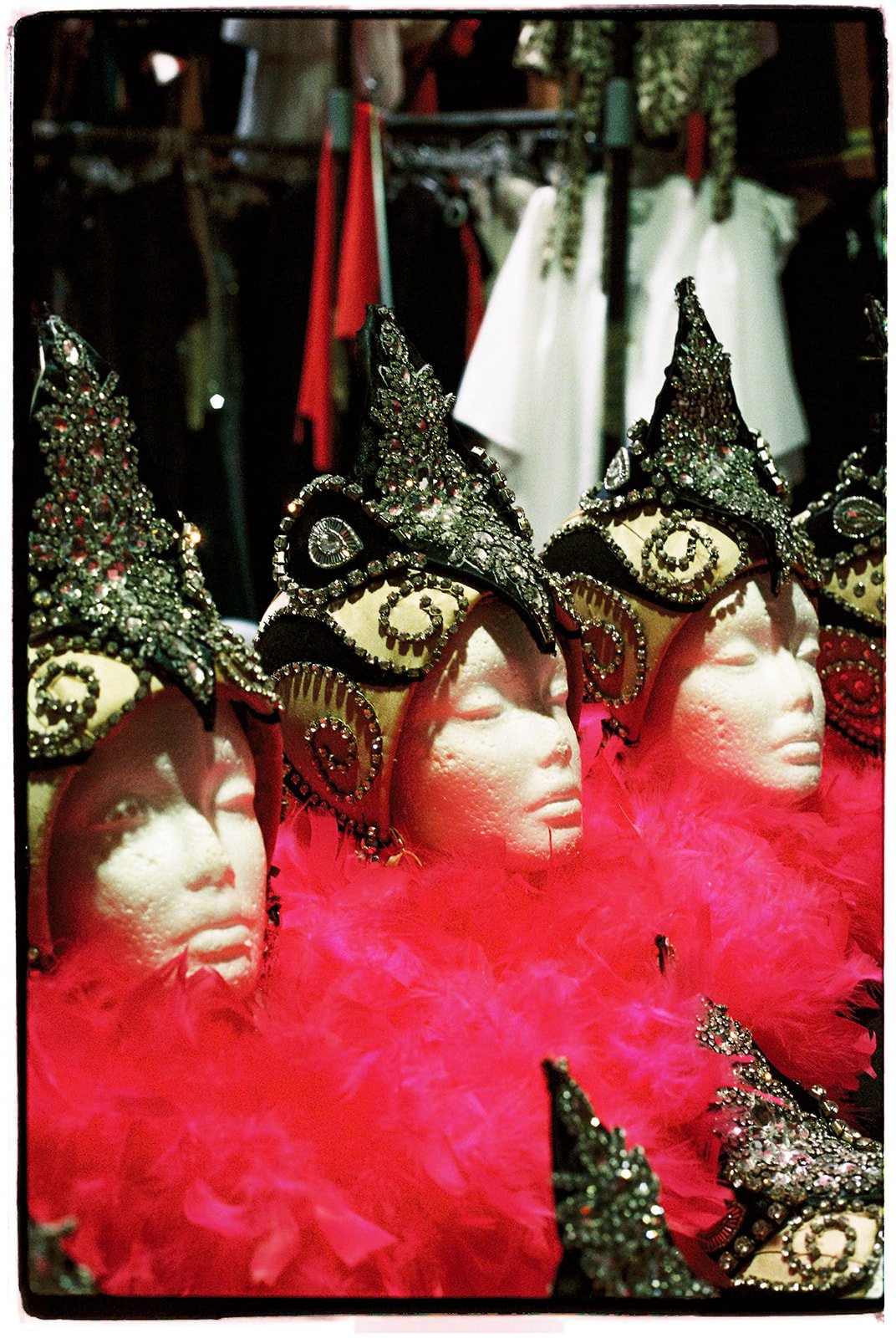 Rhinestoned showgirl headdresses with pink feathers photographed backstage at the Showgirl Bootcamp Experience.