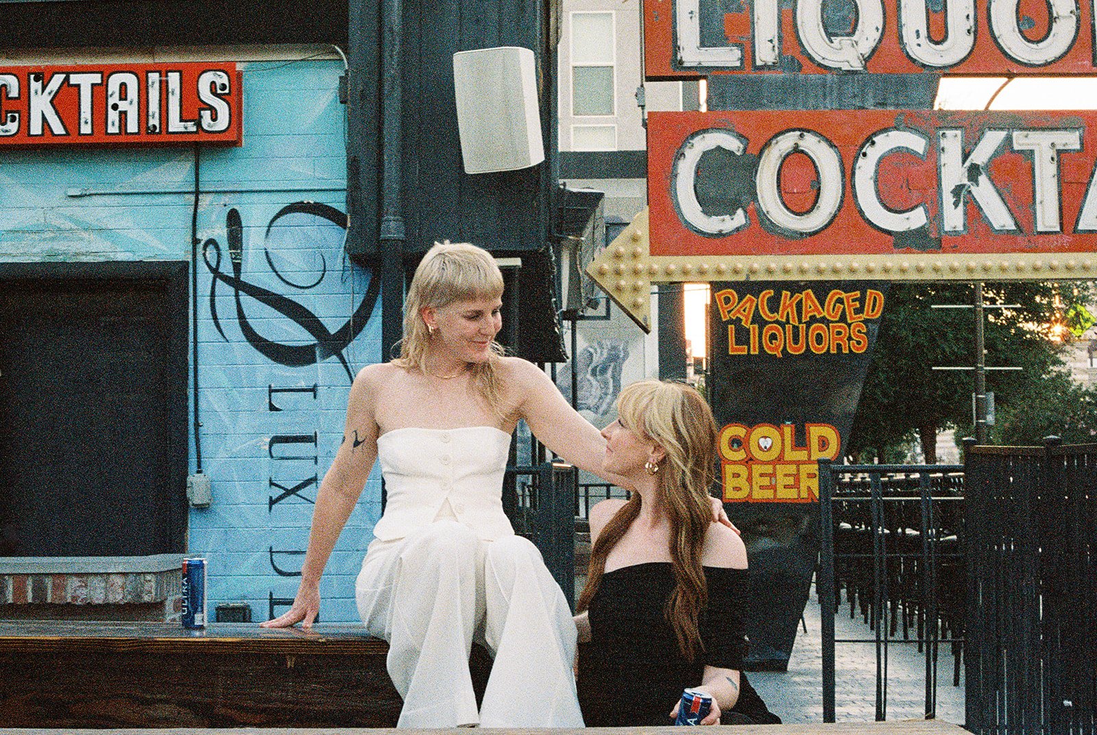 Couple posing outside of Atomic Liquors in Las Vegas.