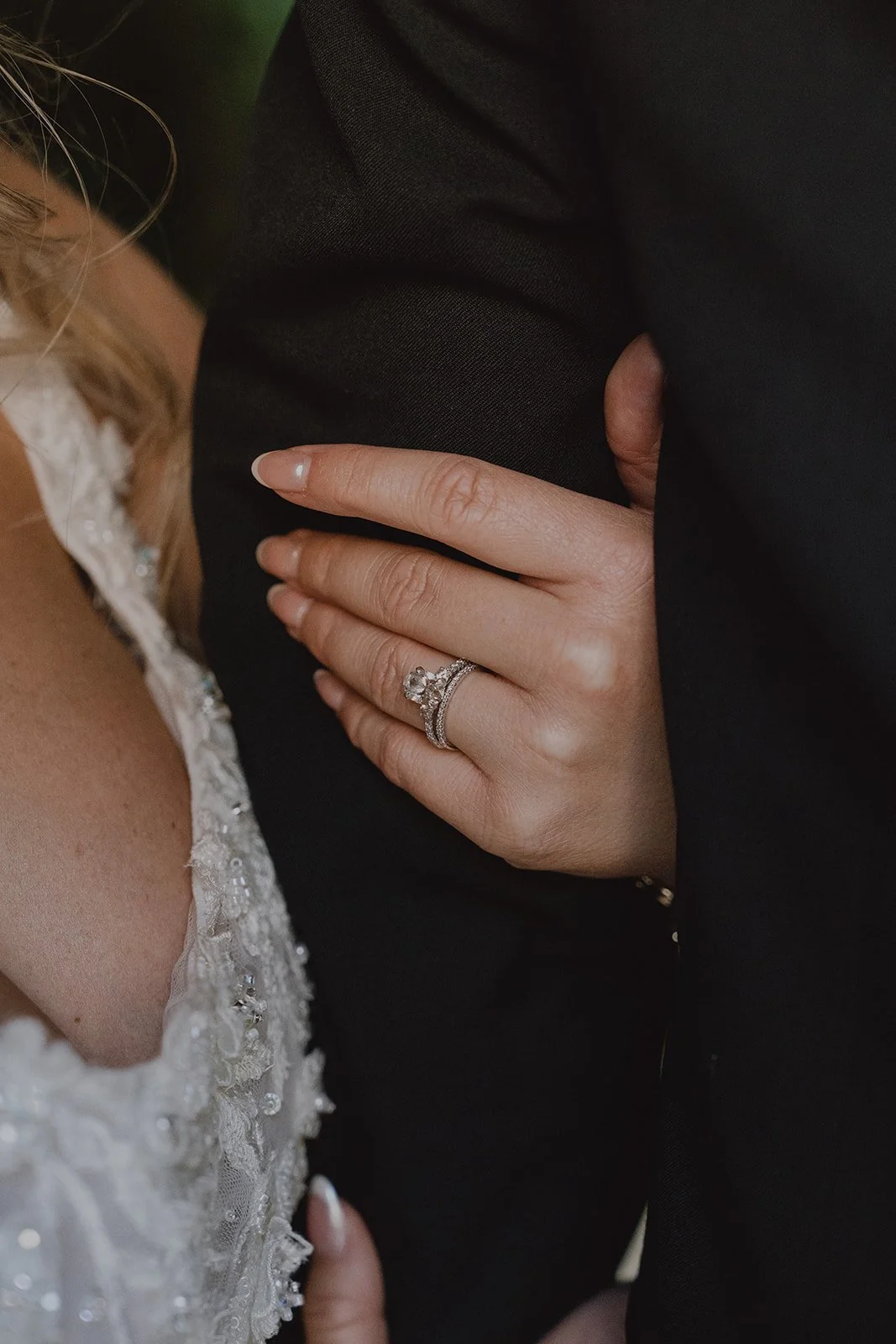Close up of a bride and groom holding on to each other
