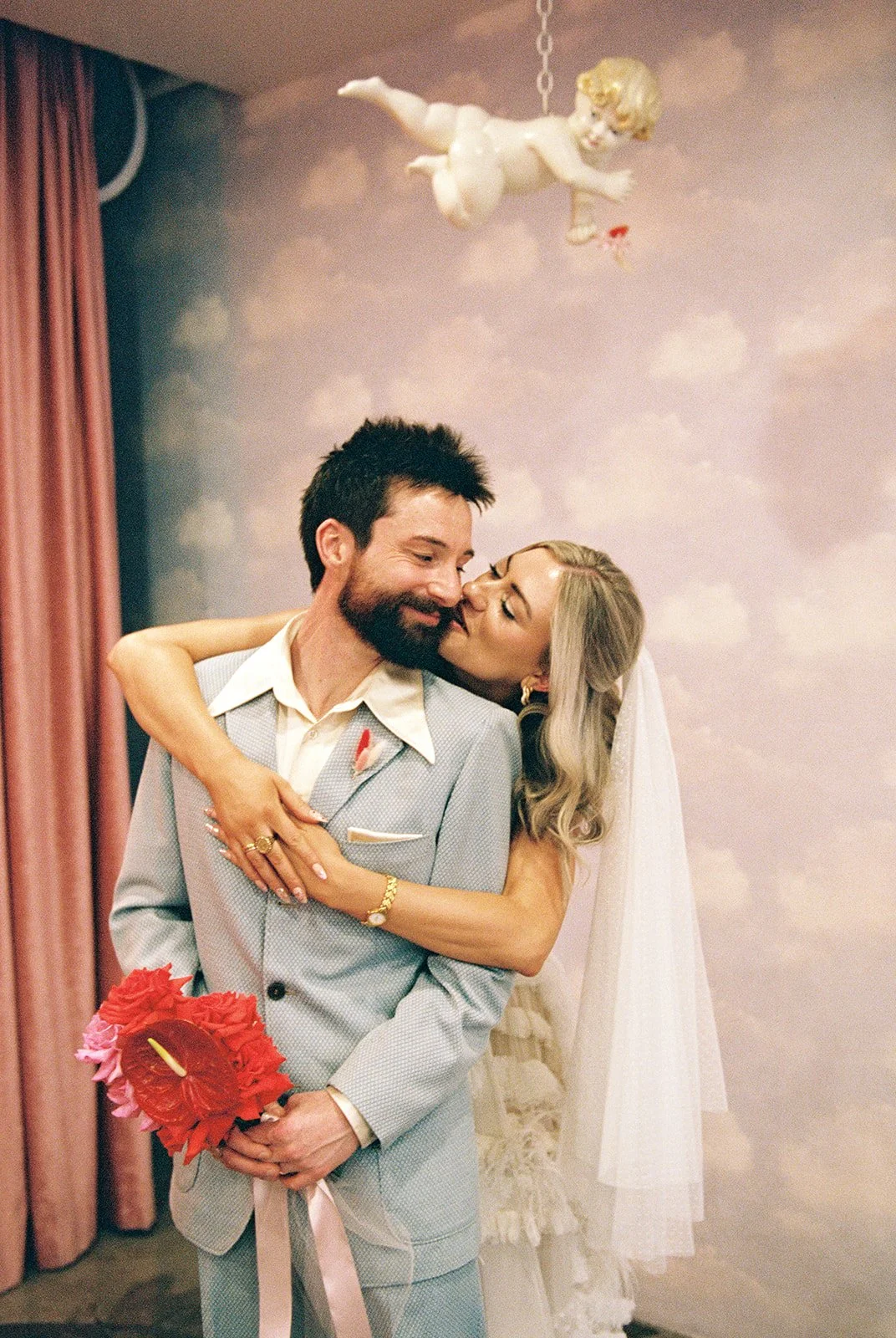 Couple hugging one another during their Las Vegas elopement at Sure Thing Chapel on 35mm film.