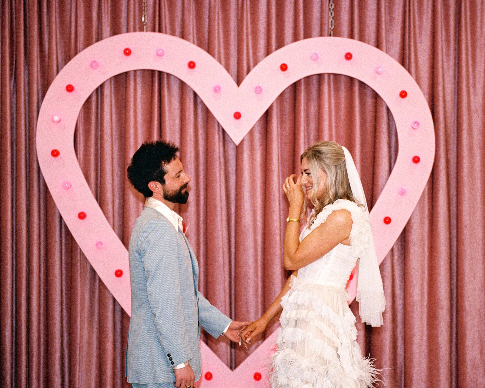 Bride and groom smiling during their Sure Thing Chapel elopement in Las Vegas.