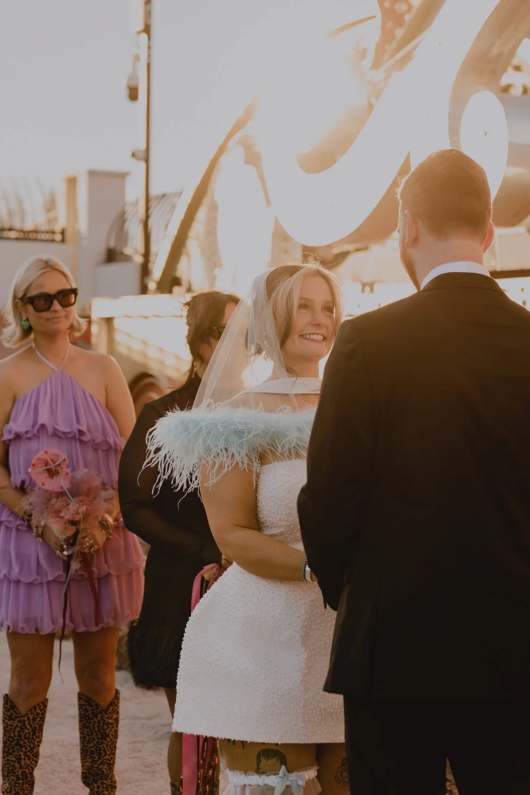 Bride and groom standing at the altar during their Neon Museum Las Vegas wedding ceremony.