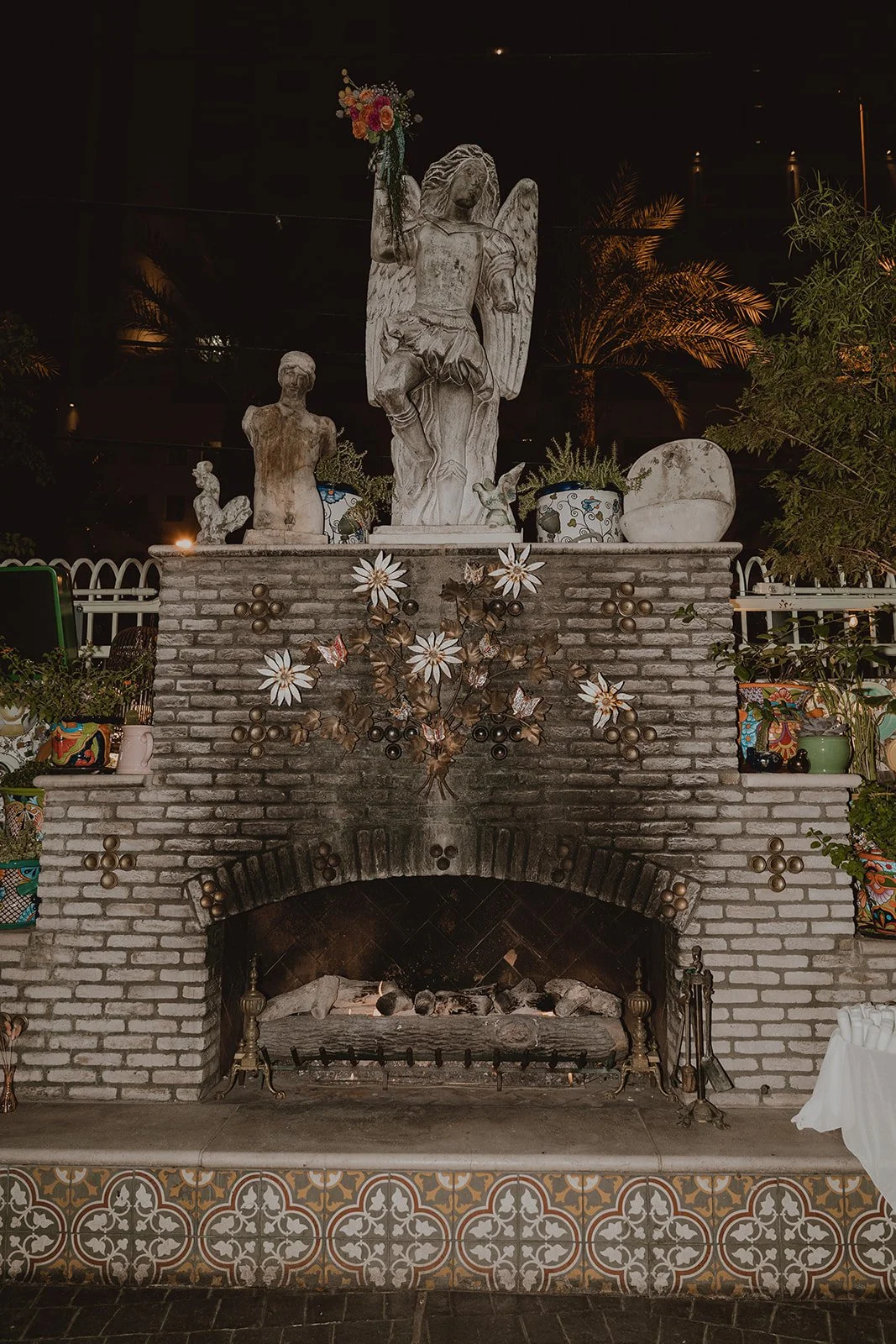 Fireplace and statue on the patio at Park on Fremont.