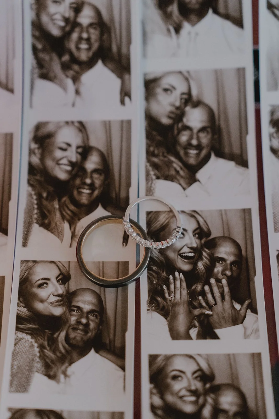 Wedding rings placed on a vintage photo booth strip from a Sure Thing Chapel Las Vegas micro wedding.
