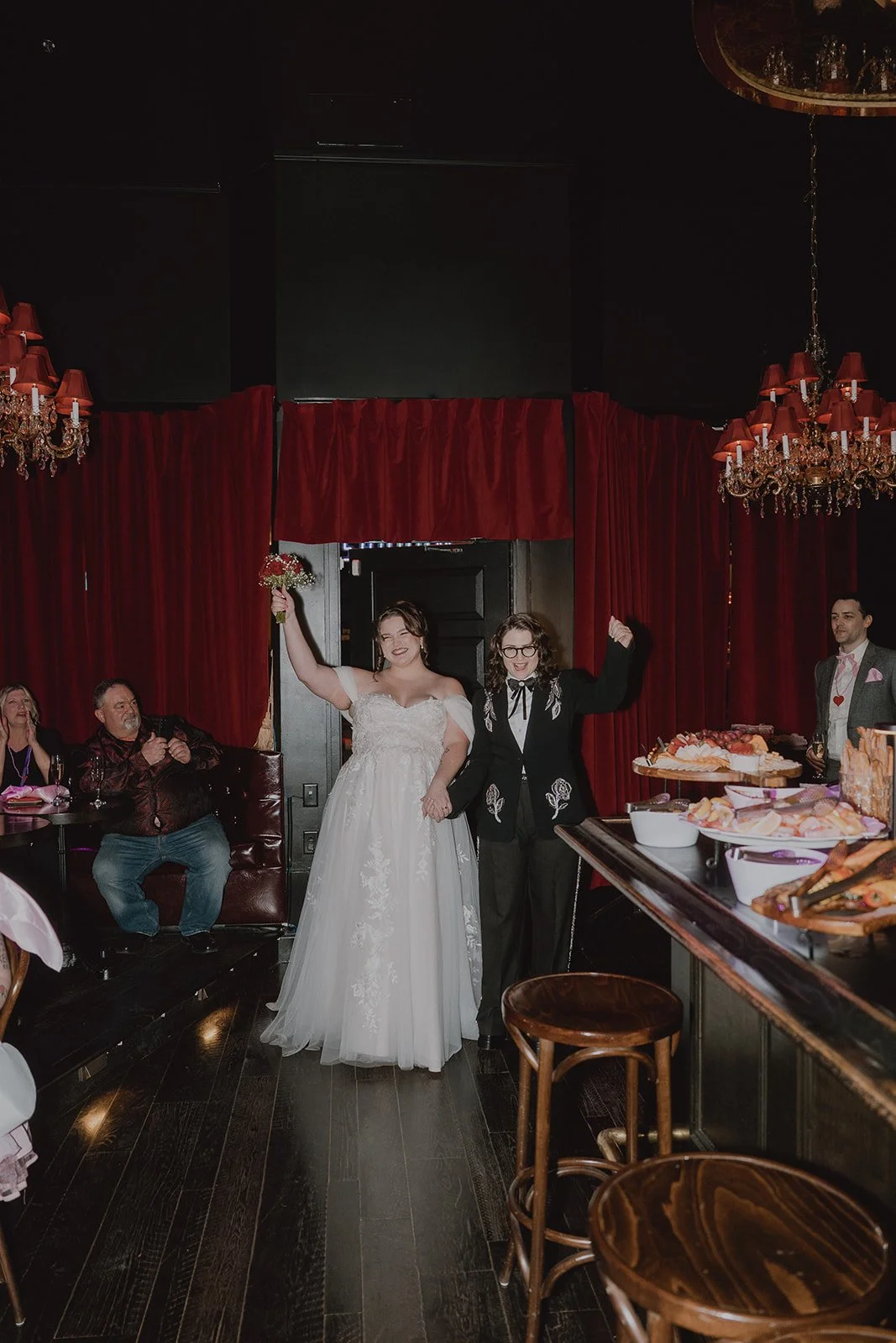 Couple entering their small Las Vegas wedding reception at Cheapshot.