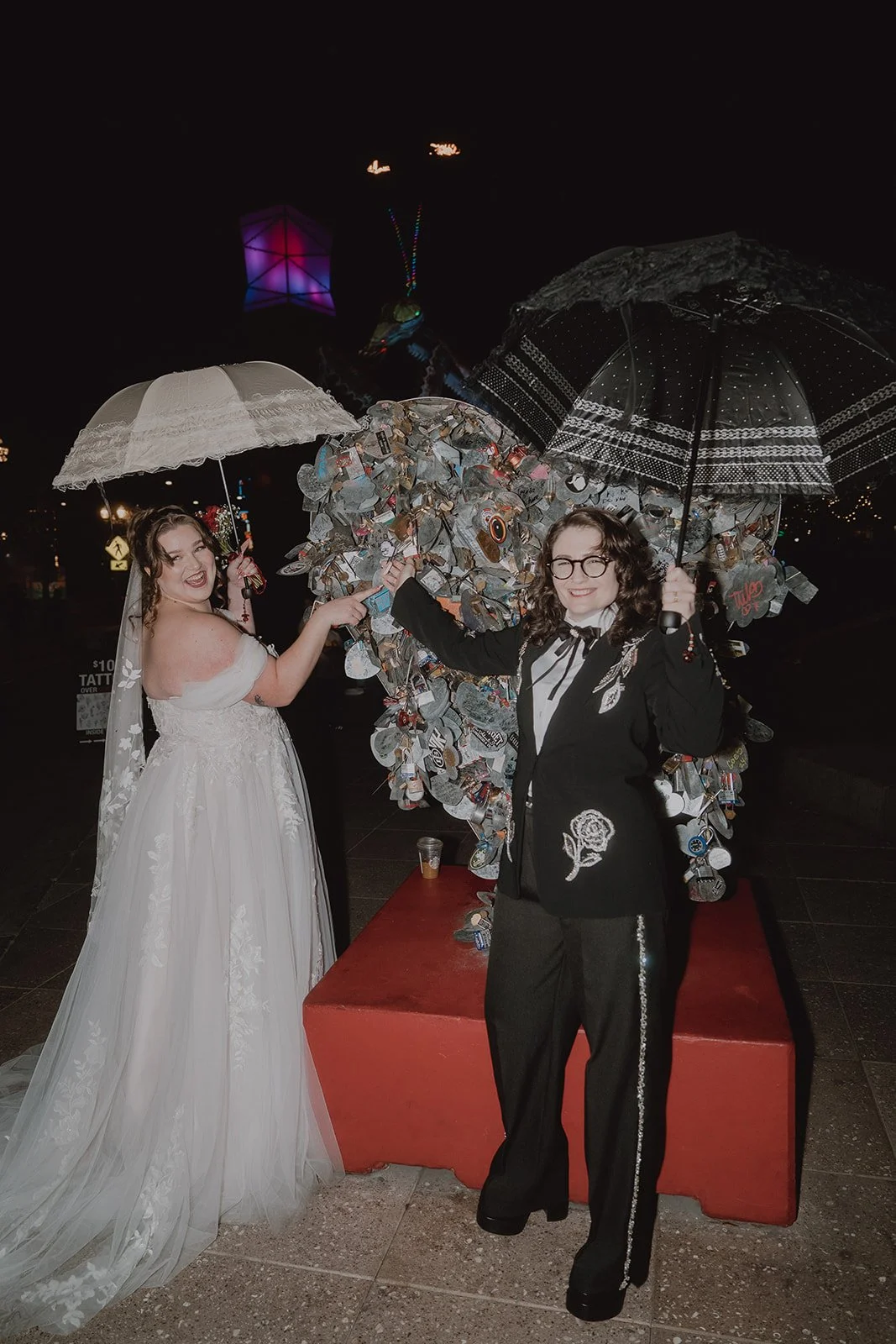 Couple posing in front of the Love Locket in Las Vegas.