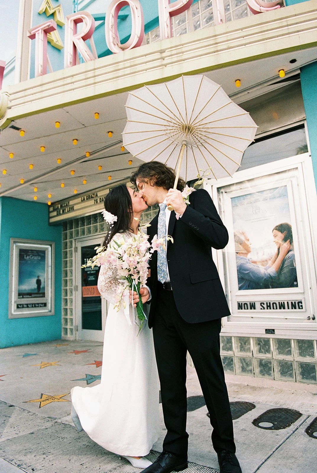 Couple kissing in front of  Tropic Cinema in Key West Florida on 35mm film.