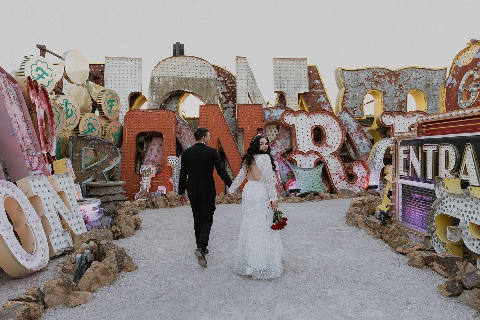 Bride and grooms Neon Museum Las Vegas wedding portraits in The North Gallery.