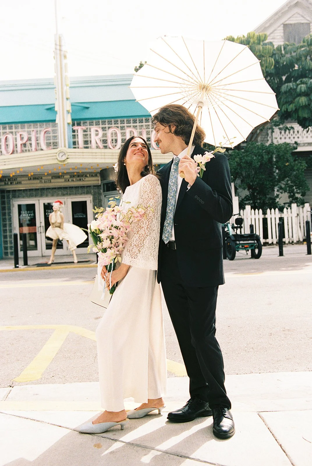 35mm film photo of a couple posing in front of Tropic Cinema in Key West Florida.